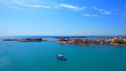 Porto Cesareo - Italy, Apulia - Aerial view of the southern promenade with Lo scoglio island with ships