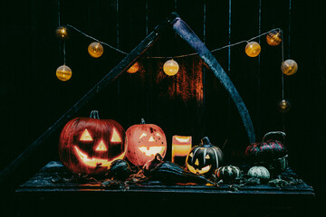 halloween - Jack O' Lanterns - Candles And String Lights On Wooden Table