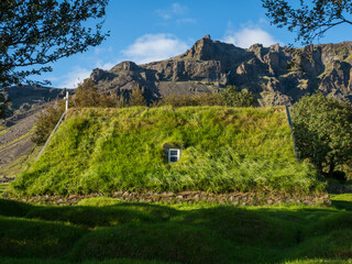 Green roof of traditional turf church in Hof, Iceland