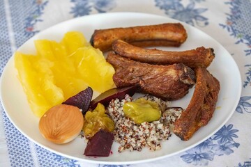 healthy superfood well balanced in nutrients, roasted pork chops,cassava, quinoa, salad, vegetables