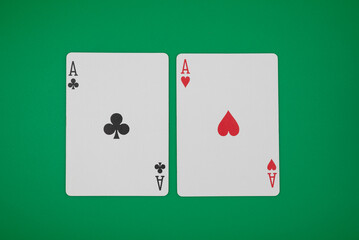 2 aces on green background, symbolizing casino games, gambling, and poker tournaments.