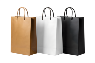Three shopping bags in different colors, brown, white, and black, isolated on a white background