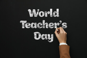 Happy Teacher's Day greeting card. Woman writing text on blackboard, closeup