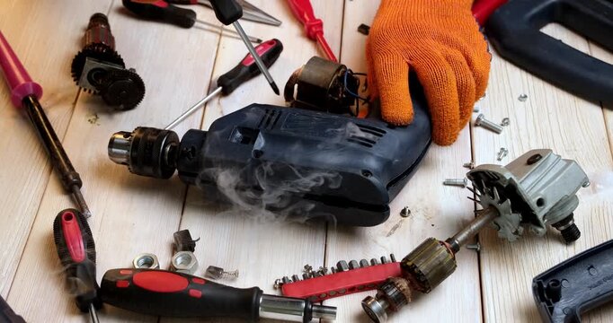 Repair of power tools. A master in a repair shop repairs a power tool High quality 4k footage