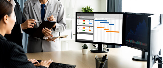 Project planning software for brisk business project management on the computer screen showing...