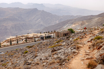 Most visited spot Jebel Jais scenic mountain landscape at Ras Al Khaimah, UAE. Breathtaking rocky peaks, winding roads, and popular tourist destination for hiking, camping, and zipline adventures