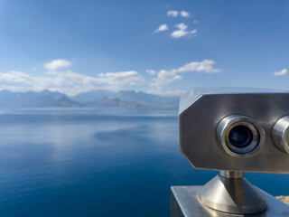 tourist binoculars with distant mountains