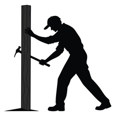 Man hammering wooden post