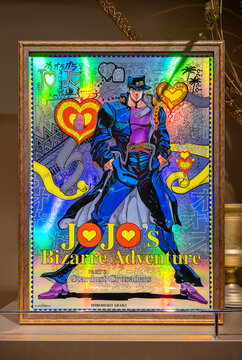 tokyo, shibuya - sep 14 2025: Holographic japanese poster of Jotaro Kujo from manga Jojo's Bizarre Adventure part 3 in a golden frame exhibited at THE★JOJO WORLD official shop of Parco by Bandai Namco