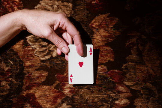 Playing Cards on a Vintage Floral Fabric Background