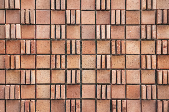 Patterned Arrangement of Bricks on an Outdoor Surface in Daylight