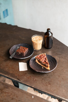 Enjoying Dessert and Coffee at a Cosy Cafe in the Afternoon