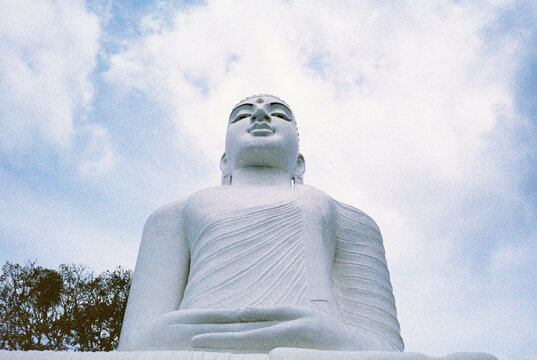 White Buddha statue, Kandy temple, Sri Lanka. Film