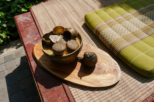 Thai traditional ornate drinking bowl inside a garden in the afternoon