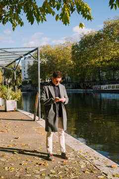 Man by autumn canal