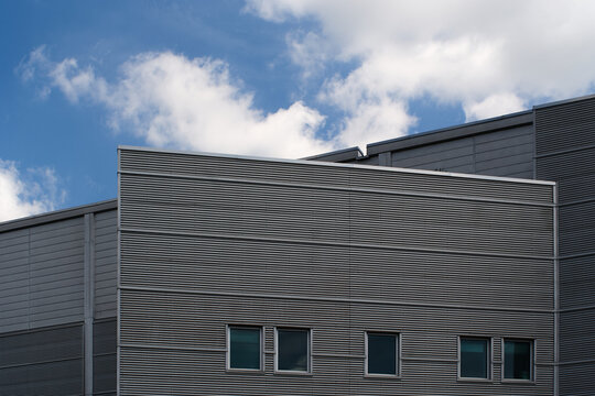 Modern Industrial Building with Cylindrical Structure and Metal Facade