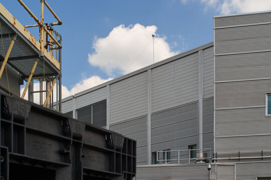 Modern Industrial Building with Cylindrical Structure and Metal Facade