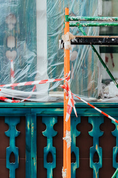 Construction site with scaffolding and safety barriers