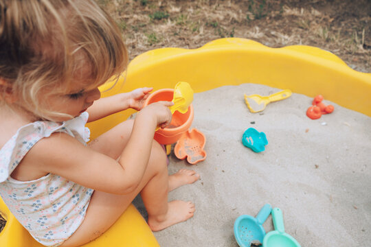 Girl playing with sand 