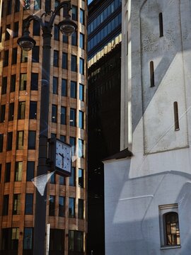 Modern buildings juxtaposed with historic architecture in city center