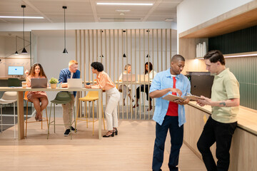 Multicultural business team collaborating in modern office