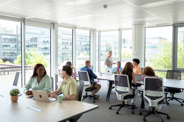 Business people working and collaborating in modern office