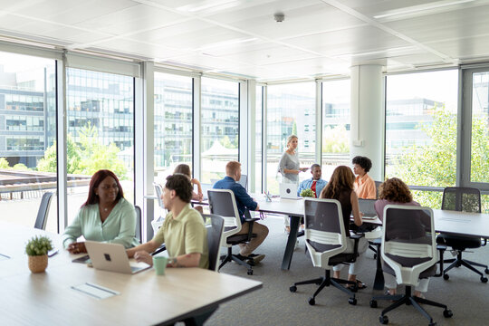 Business people working and collaborating in modern office - Powered by Adobe