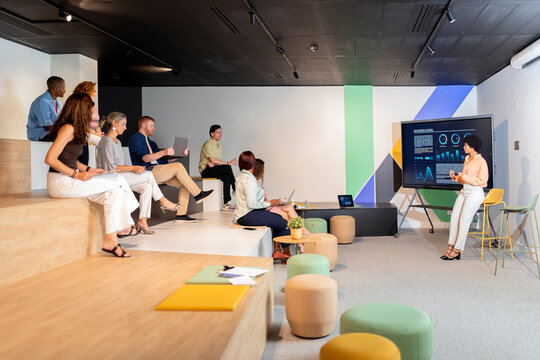 Marketing professional leading a business presentation in television