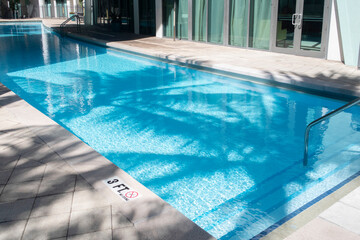 Swimming pool edge and turquoise water 