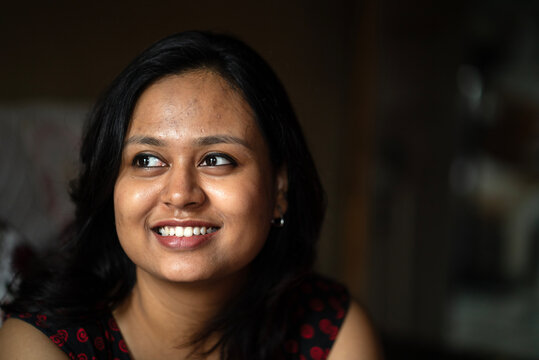 Close up portrait of a beautiful Indian woman inside home