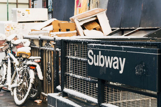 Subway sign with snow