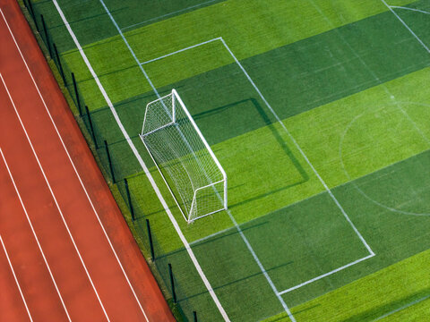 Aerial Close-up of Soccer Goal and Running Track on School Sports Fiel