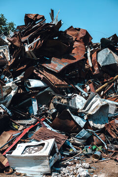 Pile of scrap metal in junkyard.
