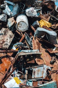 Pile of scrap metal in junkyard.