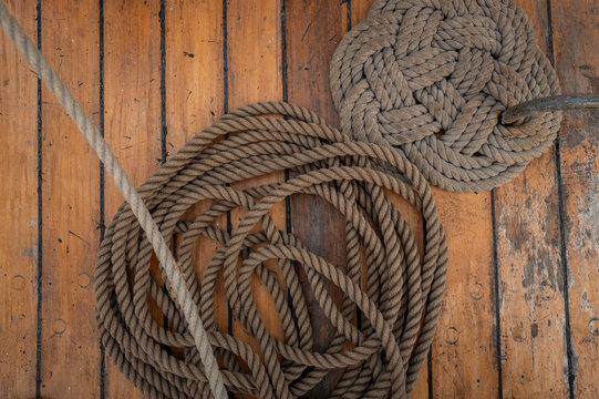 Coiled rope on wooden boat deck