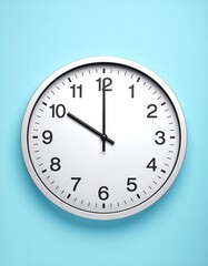 White clock face on light blue background