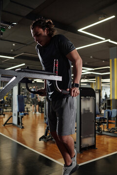 Young Man Doing Parallel Bar Dips