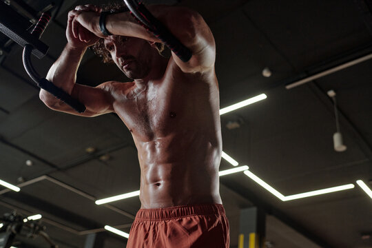 Shirtless Sportsman Having Break after Workout