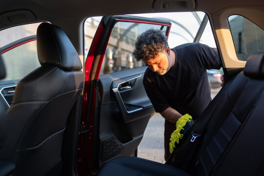 Car Detailing in Progress During Golden Hour 