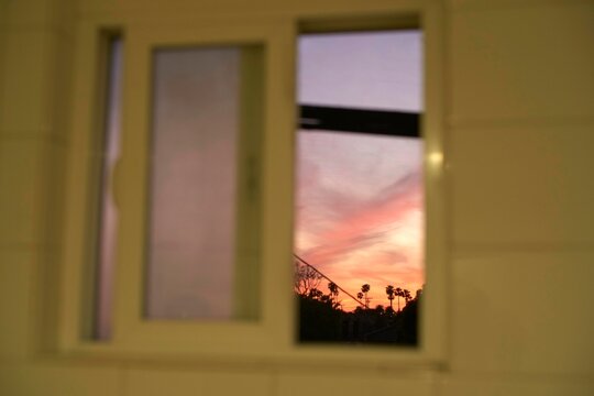 Vibrant LA Sunset Light Through a Window Frame at Dusk
