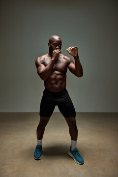 Athlete preparing for a boxing match in a studio setting
