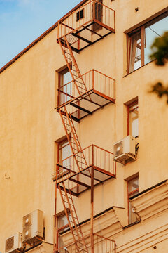 Fire escape structure on a building with window air conditioners