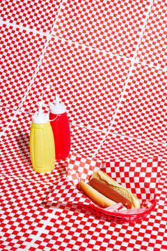 Hot Dog on Checkered Paper with squeeze bottles