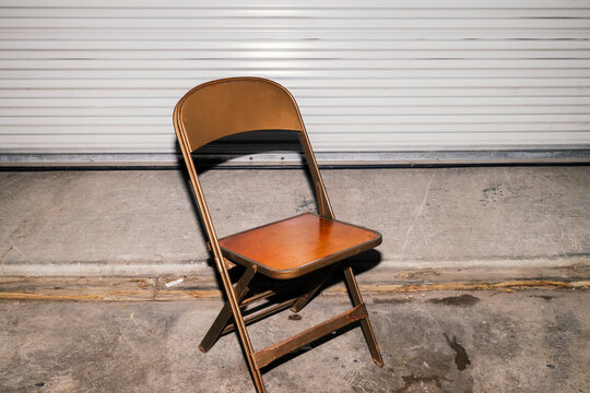 Single folding chair in warehouse