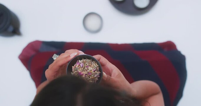 Overhead view of woman preparing tea on serving tray