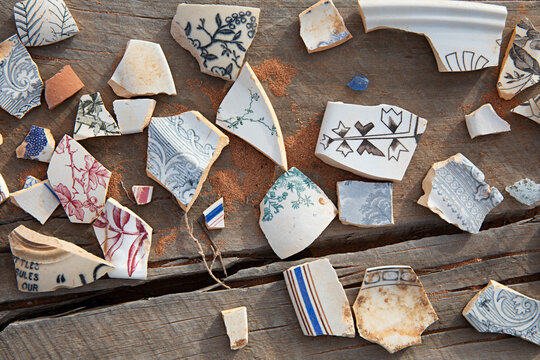 Scattered fragments of antique china, found in the ground