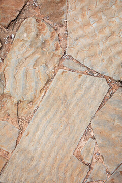 Irregular flagstones create a textured, natural stone path