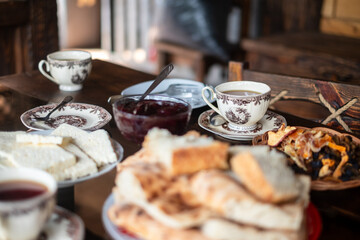 Traditional Tea Time With Pastries and Jams in Cozy Setting