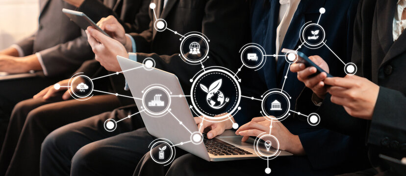 A professional setting showcasing individuals engaged with technology, emphasizing green connections and eco-friendly concepts through modern digital interactions and collaborative efforts. Amity - Powered by Adobe