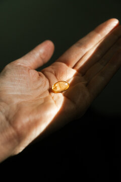 Vitamin Supplement in Hand